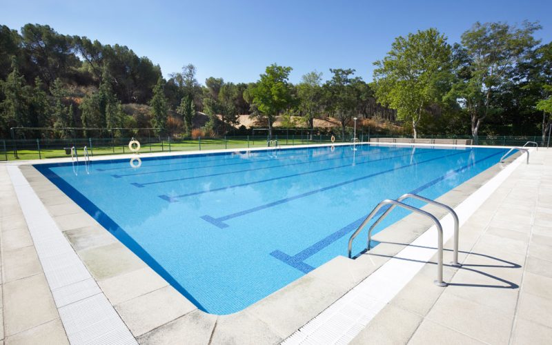 outdoor-swimming-pool-surrounded-by-trees-recreat-2025-01-27-23-22-43-utc